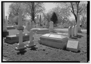 photo is in black and white and shows gravestones in laurel hill cemetery